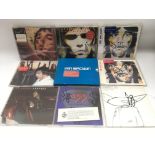 A collection of signed Ian Brown and Izaz Ibrahim CDs.