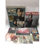 A collection of signed Pulp items comprising CDs, magazine covers etc.