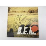 A signed REM 'Reveal' CD album in a special bookle