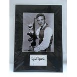 A genuine Robert Stack autograph and photo mounted