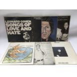 A collection of Leonard Cohen and related LPs and