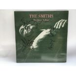 A signed 'The Queen Is Dead' LP by The Smiths, sig