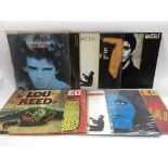 Eleven Lou Reed LPs and 12inch singles comprising