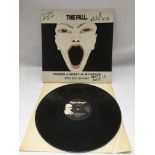 A signed 12inch single by The Fall 'There's A Ghos