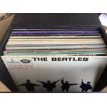 A record box containing an eclectic mix of various