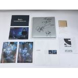 A signed collection of promotional materials for T