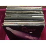 A box of LPs by various artists including Queen, T