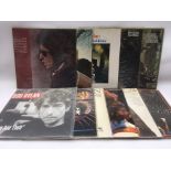 A collection of Bob Dylan LPs.