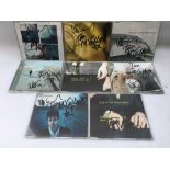 Eight signed Echo & The Bunnymen CDs.