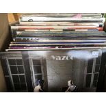 A box of LPs and 12inch singles by artists from th