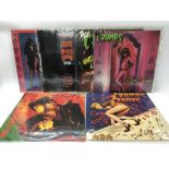 Six The Cramps twelve inch singles and one ten inc