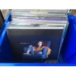 A box of 12inch singles and LPs by artists from th