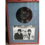 A framed and glazed signed black and white photo of The Who depicting Roger Daltrey, Pete Townshend,