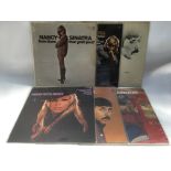 Six Nancy Sinatra LPs.