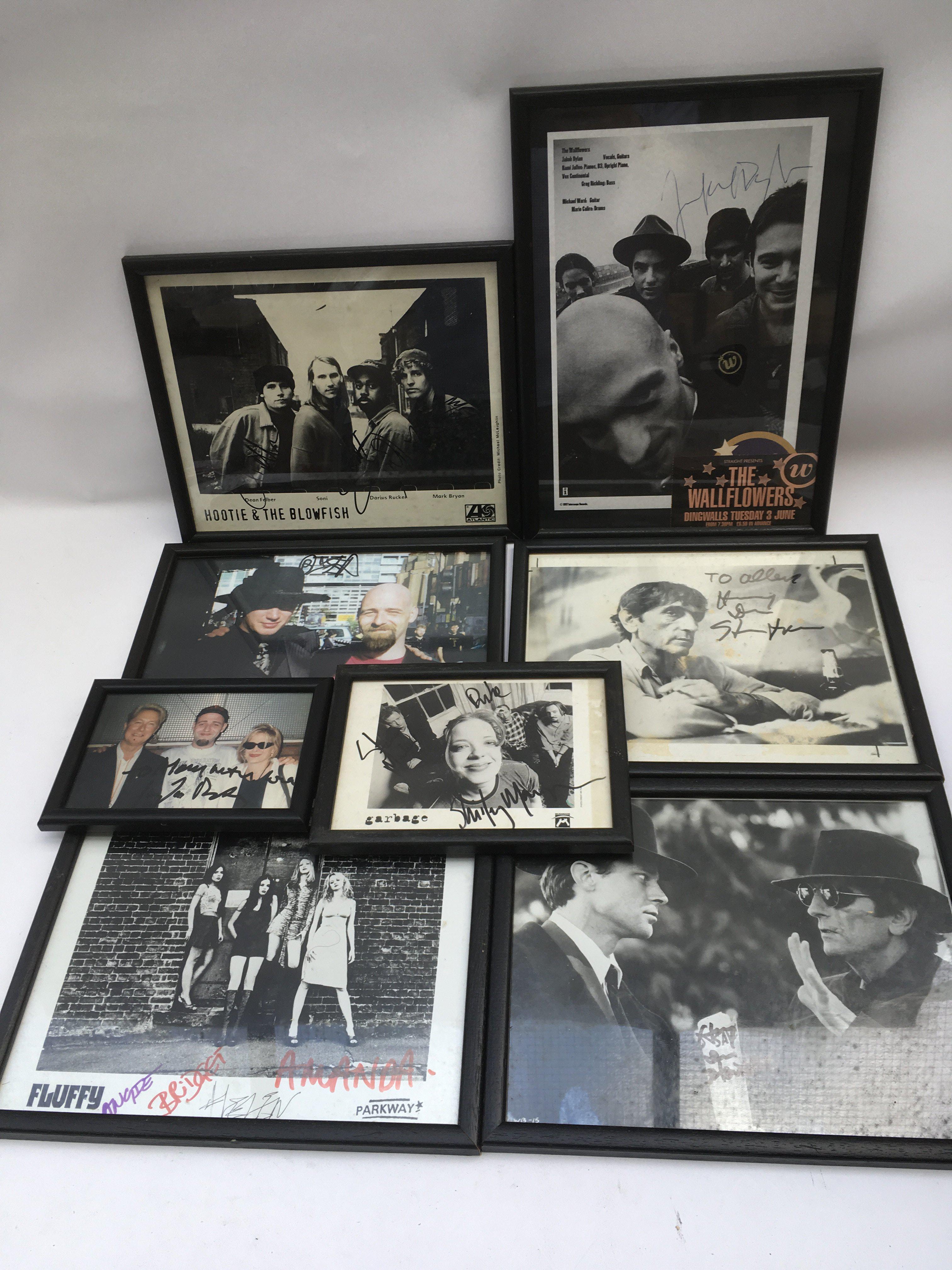 Two boxes of framed photos and publicity shots of