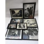 Two boxes of framed photos and publicity shots of