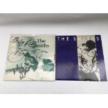 Two signed 7inch singles by The Smiths comprising
