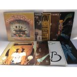 A collection of LPs by various artists including T