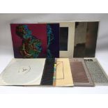 A collection of New Order vinyl records comprising