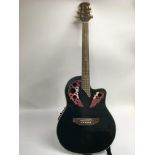 An electro acoustic Coban bowl back guitar in the