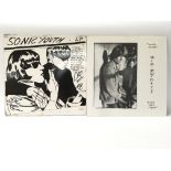 A signed copy of Goo by Sonic Youth alongside an u