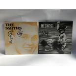Two signed 12inch singles by The Smiths comprising