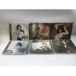 Six signed Patti Smith CDs. Please note that these are not signed by Patti Smith but by Lenny Kaye