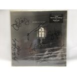 A sealed and fully signed 1997 first pressing of P