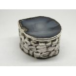 A modern design silver box the shaped top inset wi