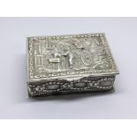 A Silver box decorated with raised figures with a