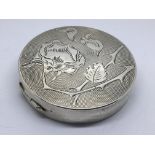 A Continental circular silver box engraved with a