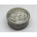 A Silver box of circular decorated with mythologic