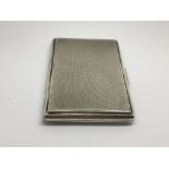 An Engine turned silver cigarette case of rectangu