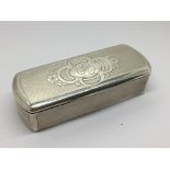 An Engine turned pattern silver box with oval ends