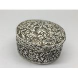 A 19th century oval silver box with detachable cov