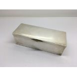 A Silver box of rectangular shape with a hinged li