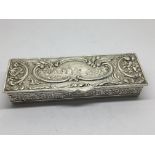 A silver box of rectangular shape decorated with a