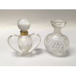 A Nina Ricci Lalique glass scent bottle with a gilt collar and one other Ricci scent bottle (2)
