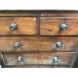 A mahogany Victorian chest of drawers fitted with two short and three long drawers
