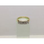 An 18ct gold three stone diamond ring, approx 1ct, approx 4.47g and approx size L.