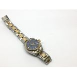 A Rolex Oyster Perpetual Date Adjust wristwatch, having blue dial and two tone strap, with box and