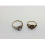Two 9ct gold rings set with diamond chips and garnets, approx 5.1g and approx sizes N and T.