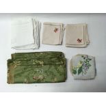 A group of linen pieces consisting of table settings and others. One box and one bag.