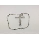 An 18ct white gold crucifix set with diamonds on a chain, approx 9.9g.