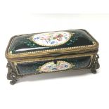 A French 19th Century enamel box of rectangular shape, decorated with ovals of flowers. 20x10cm.