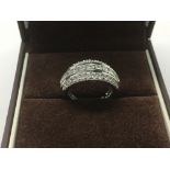 An Ernest Jones 18ct white gold ring set with diamonds, approx J-K and approx size 5.83g.