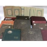 A collection of largely unused, vintage cigarette card albums