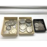 A small group of silver coins including half crowns and sixpences