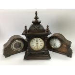 Three old mantle clocks comprising two oak cased examples and a mahogany clock with two subsidiary