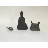 A group of three items including an Oriental seated brass figure with hand movement, an orientalists